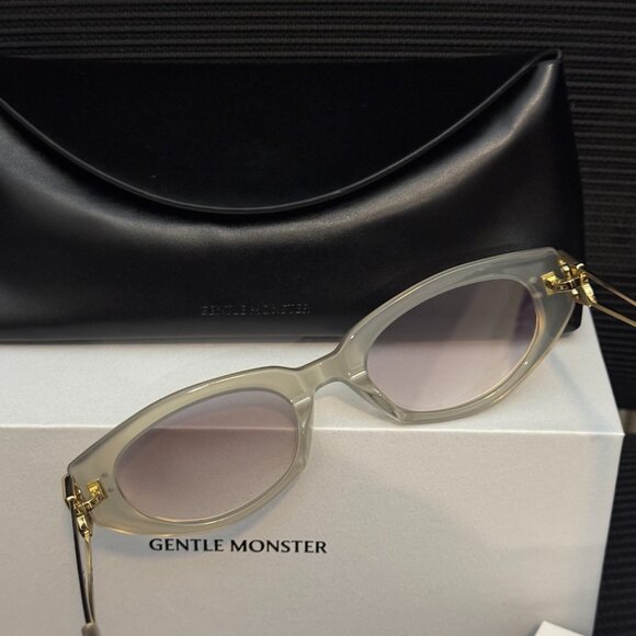 Gentle Monster Translucent Oval Sunglasses Gold Logo Chic Luxe